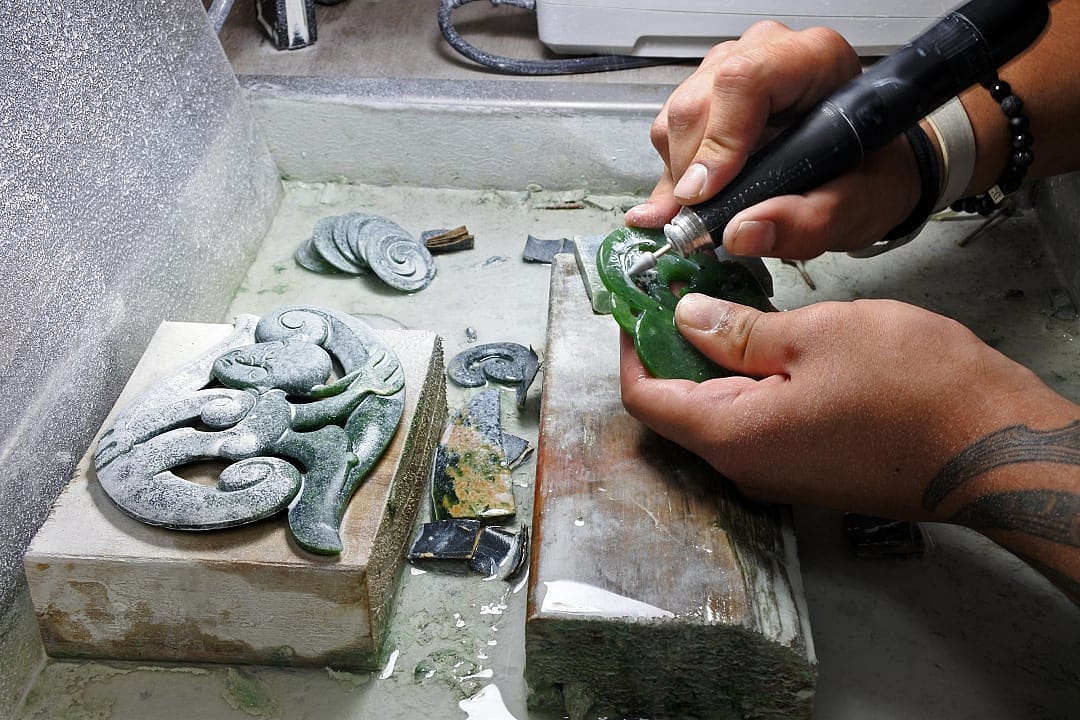 Hands of a Māori jade rock carver in New Zealand