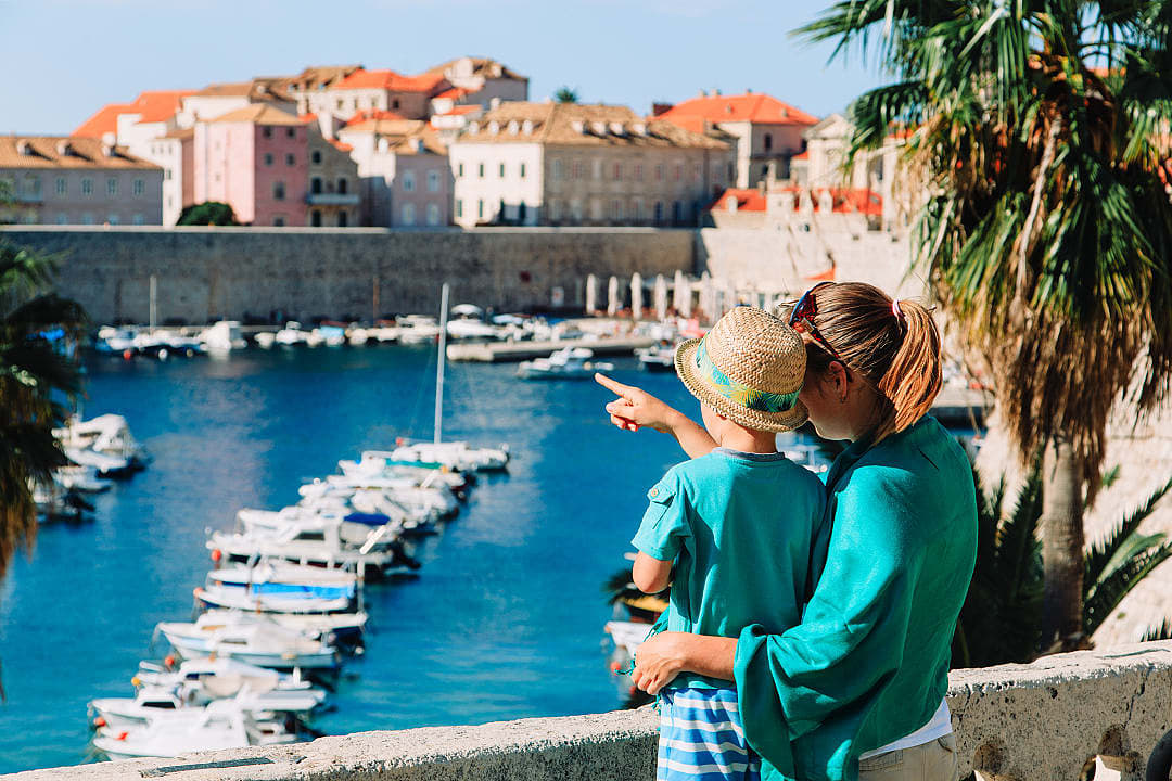 Mother and son looking at the harbor in Dubrovnik, Croatia