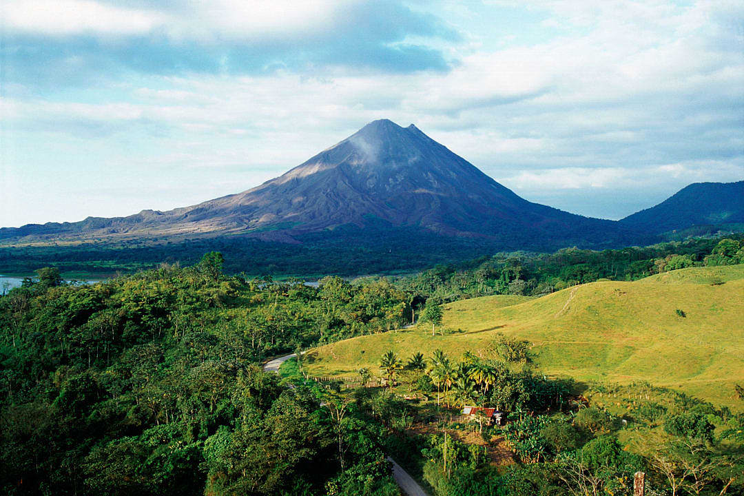 Arenal Volcano in Costa Rica, surrounded by lush rainforest.