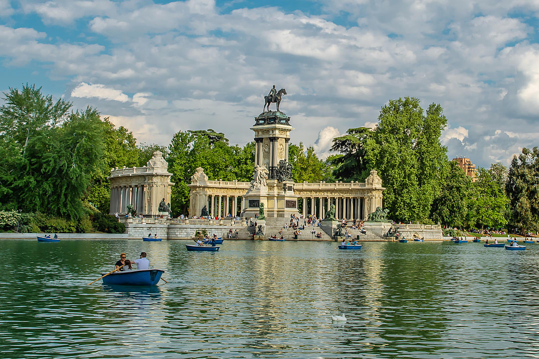 Family boating on the lake at  Retiro Park in Madrid