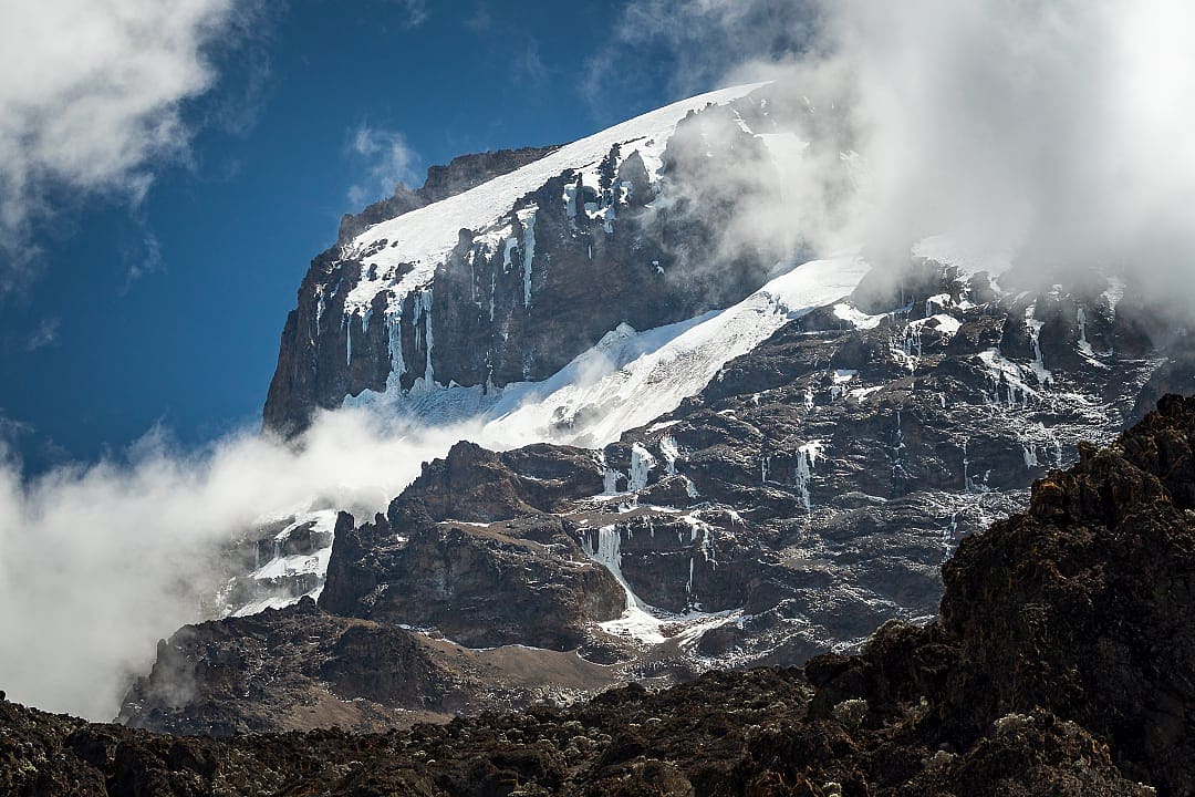 The upper slopes of Mount Kilimanjaro covered in snow.