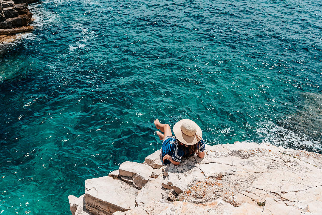 A woman enjoying herself on the Dalmatian Coast of Croatia.