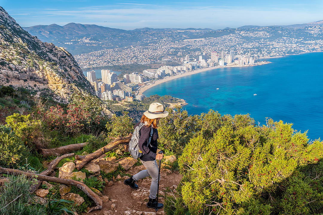 Woman hiking Penyal d'Ifac Natural Park in Calp, Spain