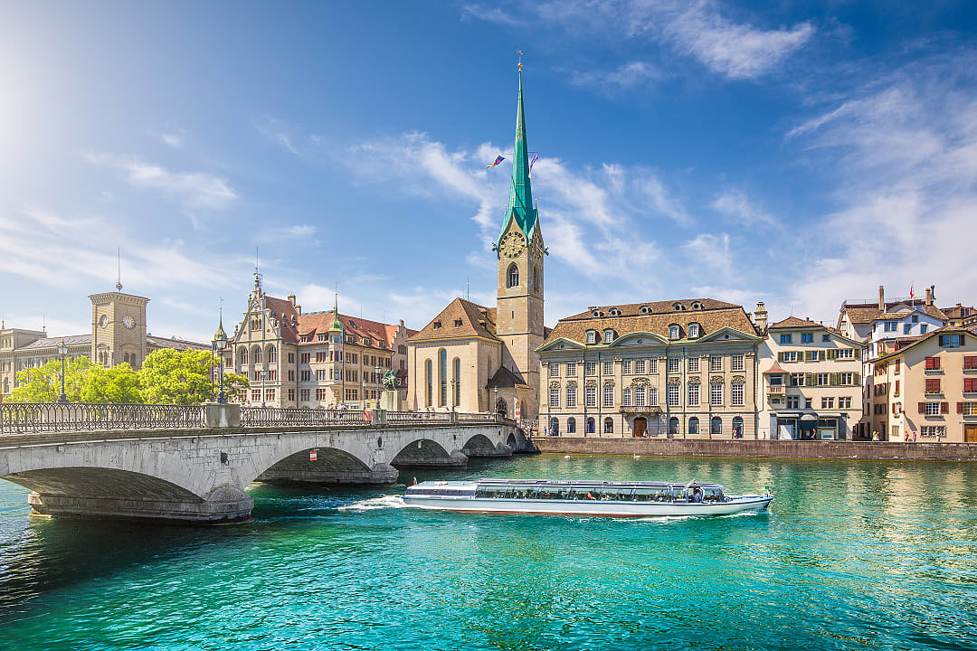 Zurich center with boat on river Limmat, Switzerland