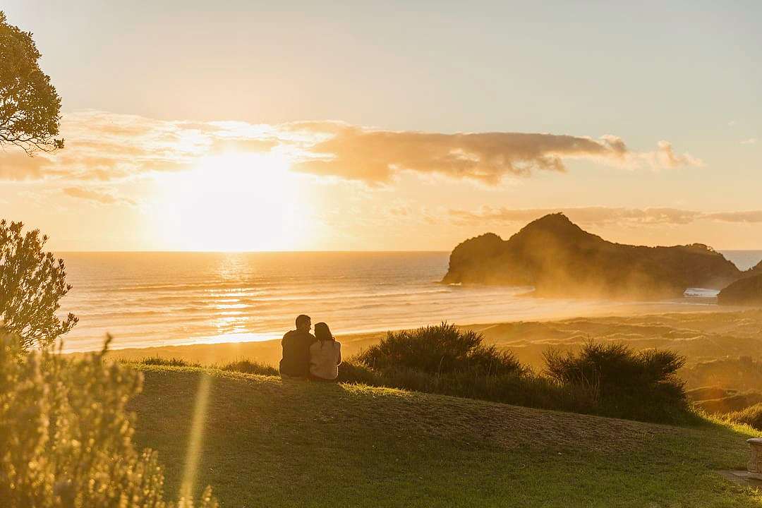 Couple watching the sunset in Auckland.