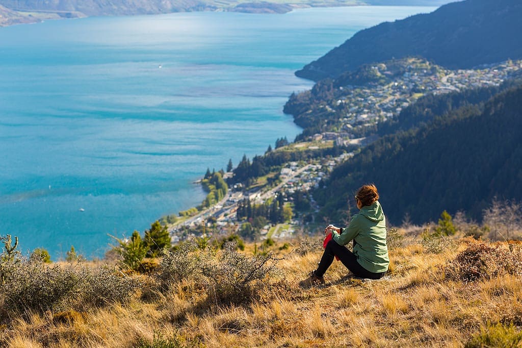 Woman looking at the view in Queenstown, New Zealand