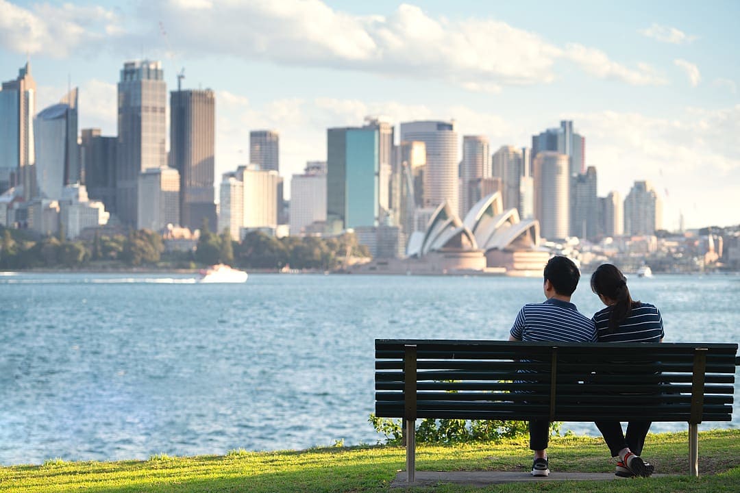 A couple sightseeing while enjoying the view of Sydney, Australia.