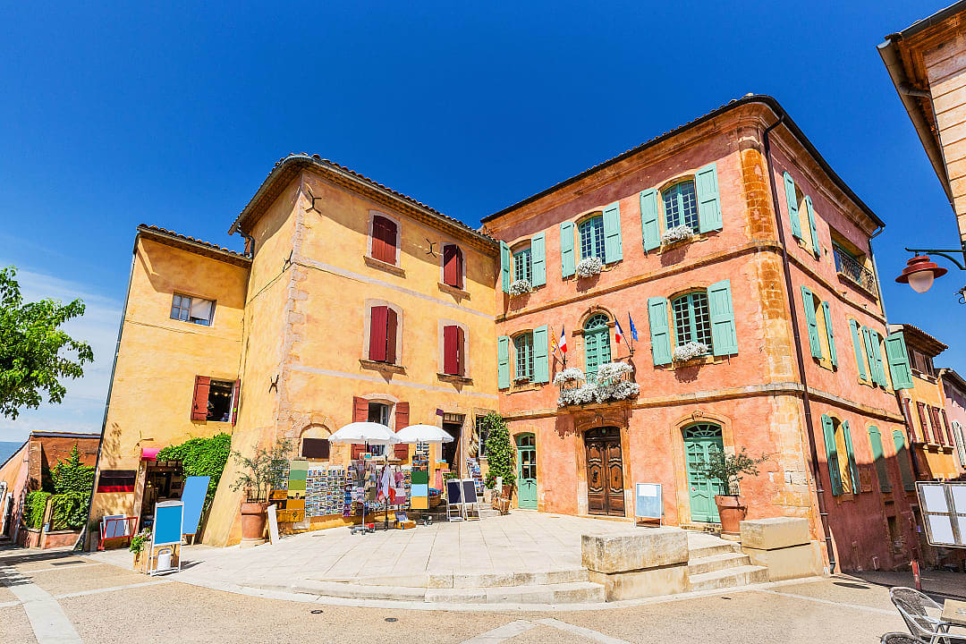 Colorful buildings in the village of Roussillon, Provence, France, known for its ochre cliffs and charm