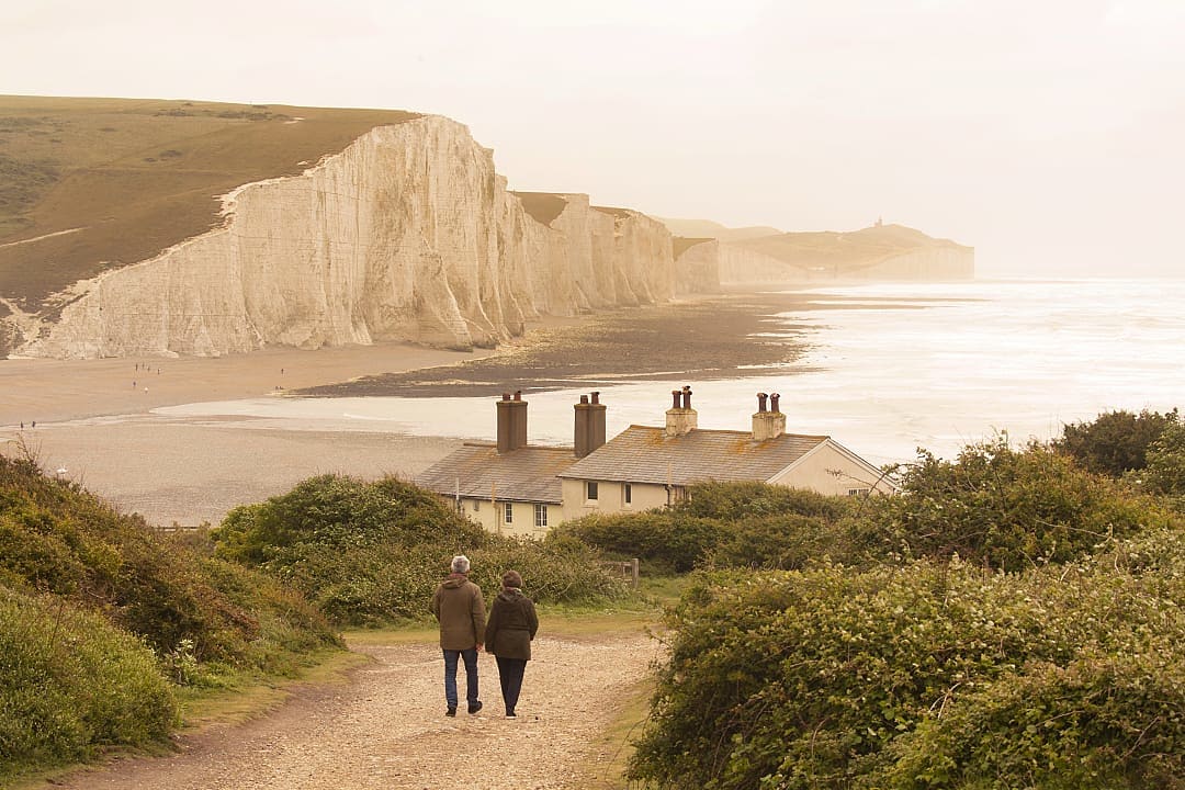 Senior couple at Seven Sisters Cliff in England.