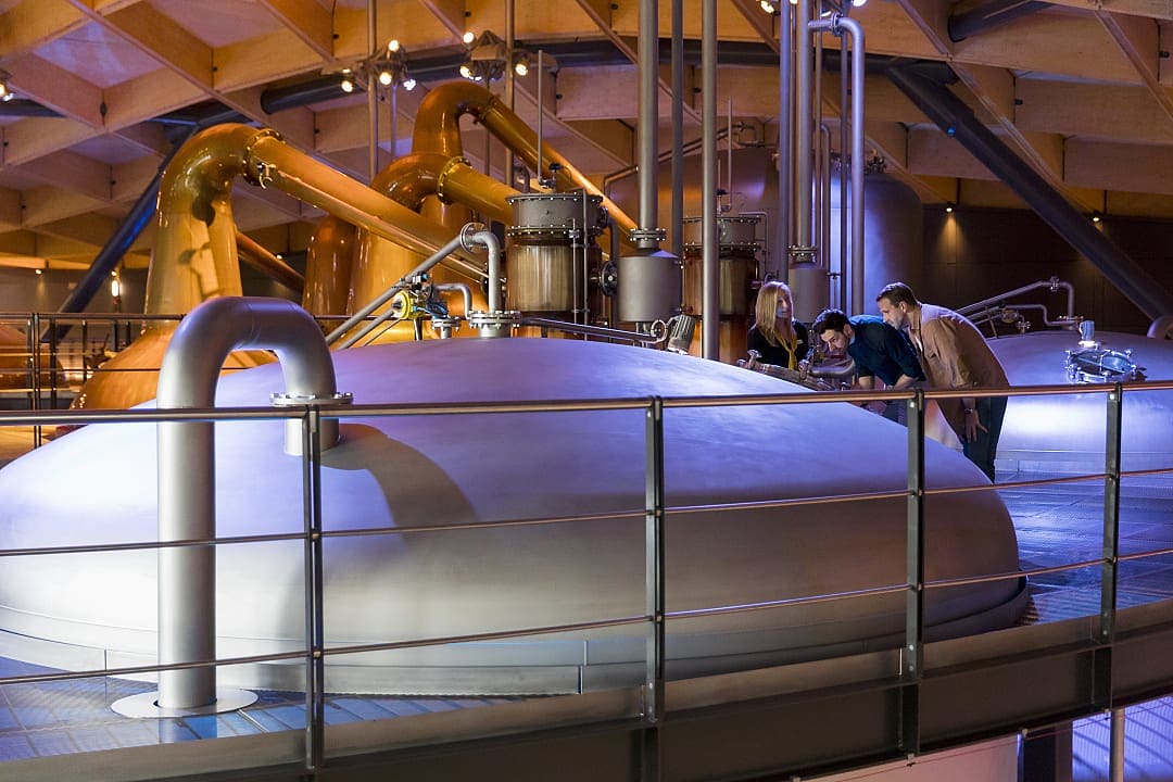 Couple getting a private tour at Macallan Distillery in Aberlour, Scotland