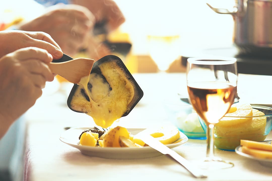 Traditional Swiss raclette and wine