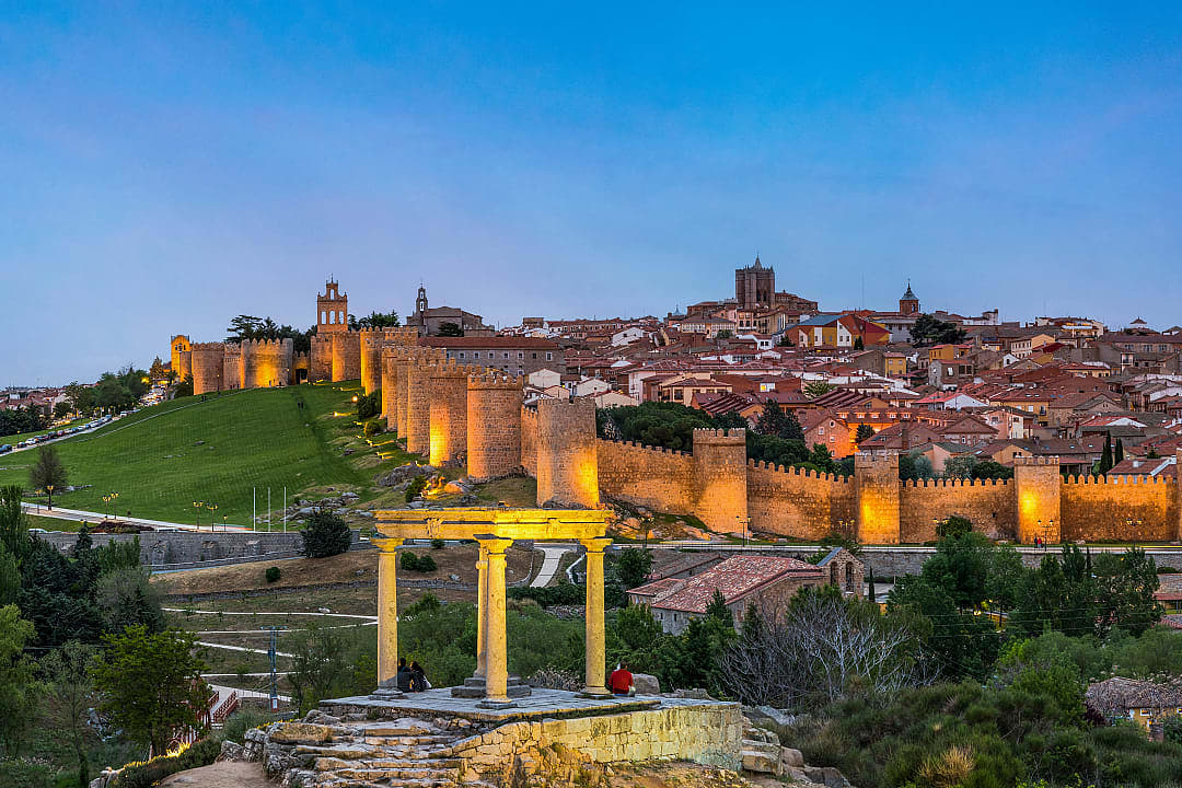 Couples at viewpoint overlooking Avila, Spain