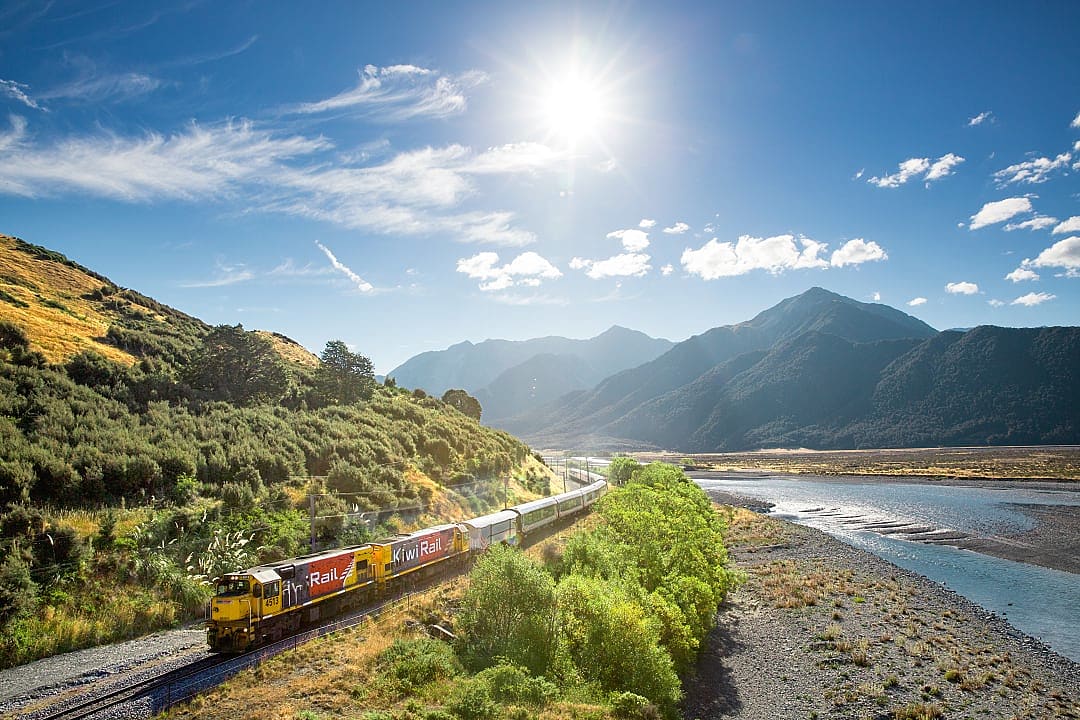 TranzAlpine train along the Waimakariri River in New Zealand