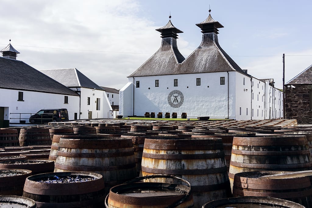 Whiskey barrels outside a distillery in Scotland