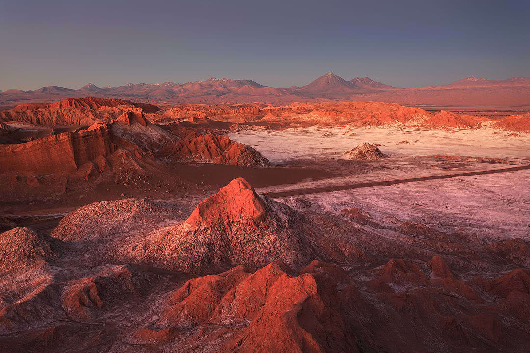 Sun setting on the Valley of the Moon, casting a striking red hue.