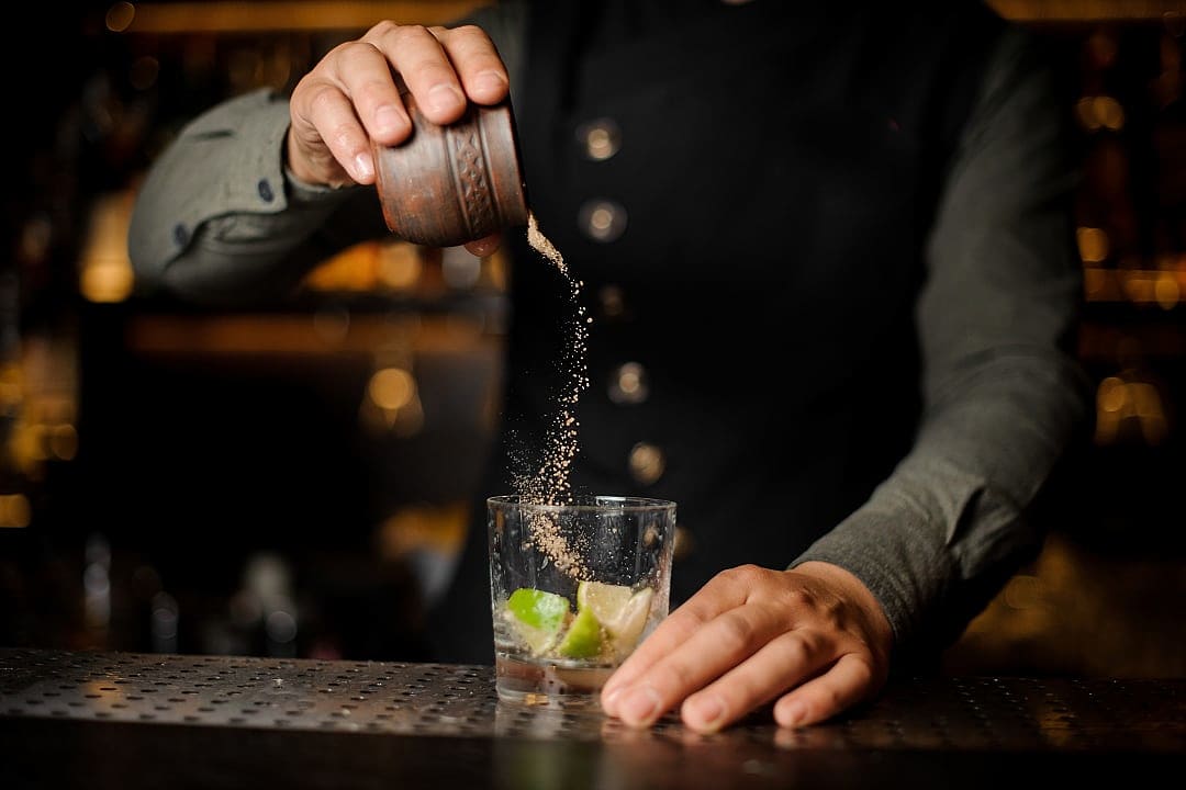 Bartender making a Caipirinha drink in Brazil