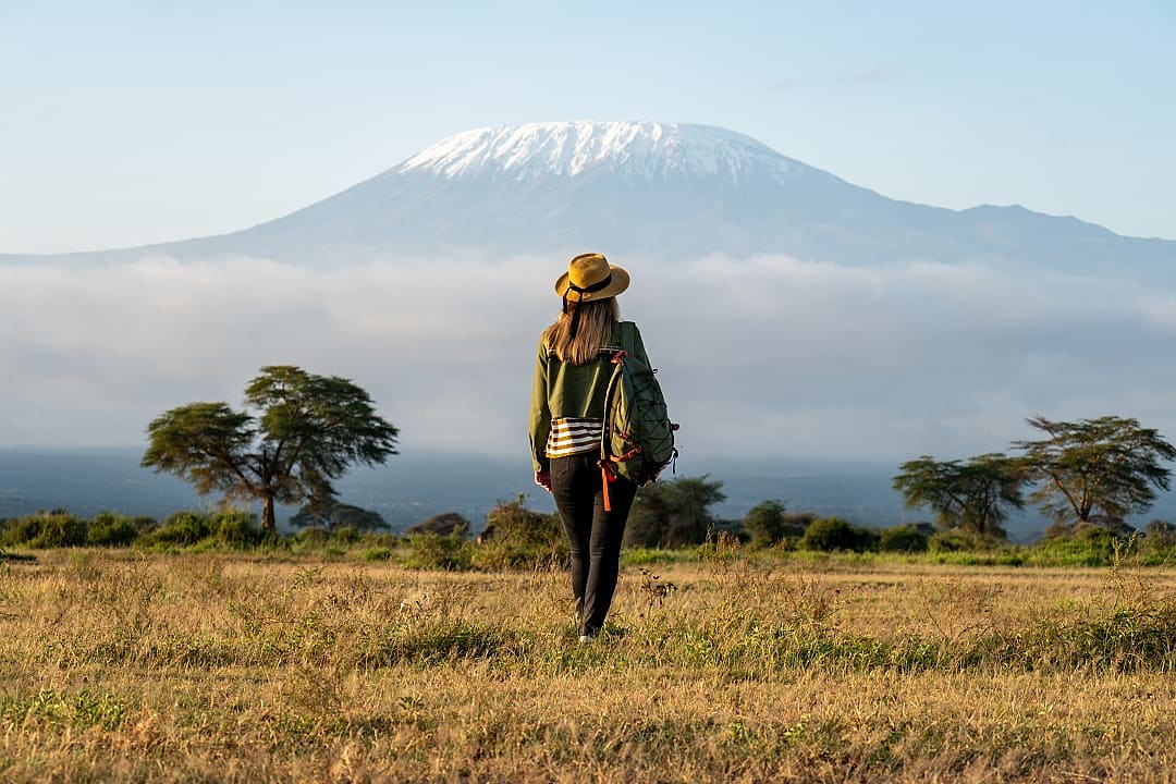 A woman admires the Uhuru Peak.
