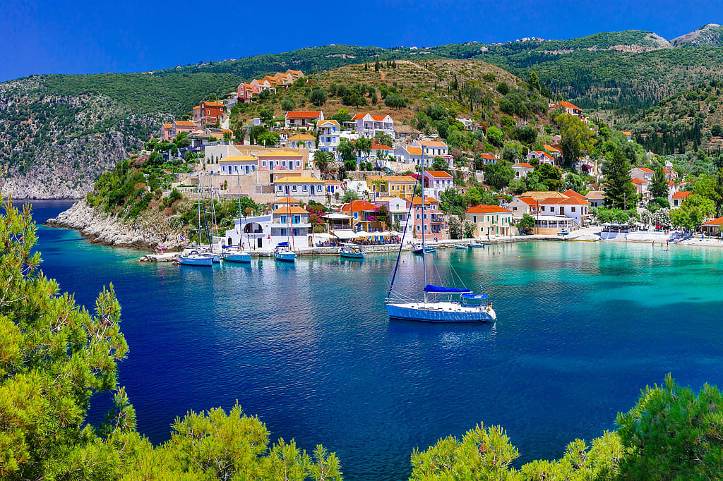 Sailing yacht mored in the bay at Assos on Kefalonia island, Greece.