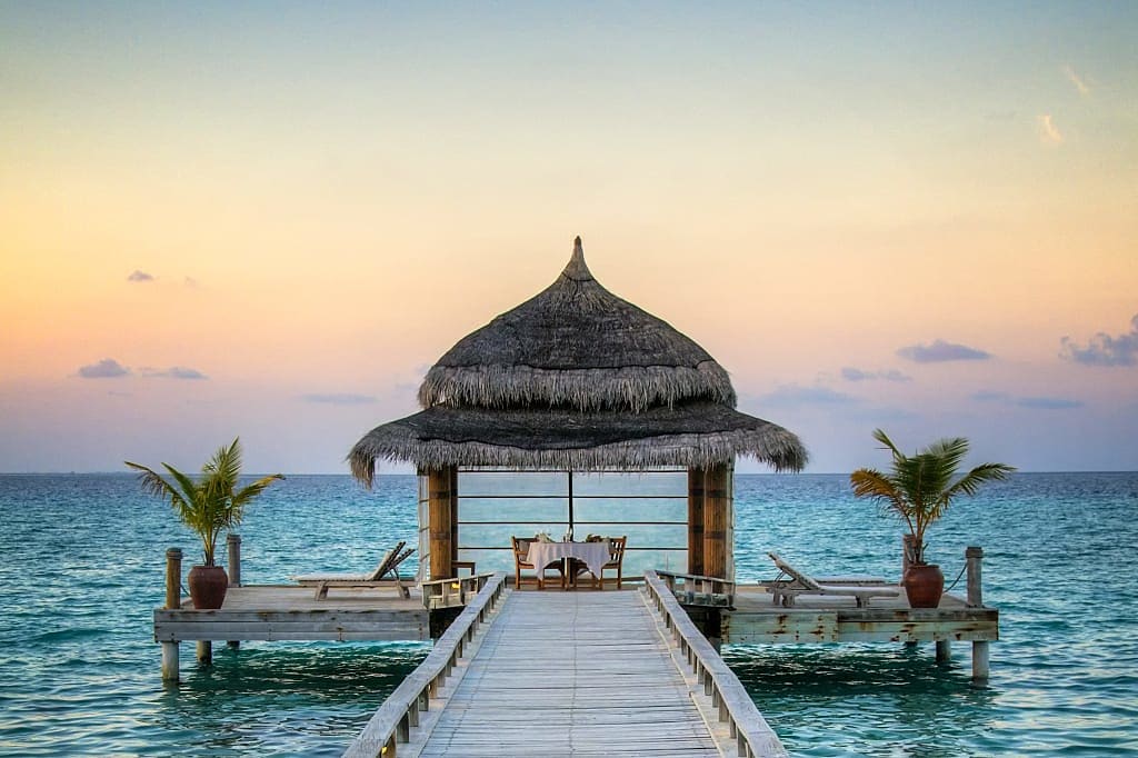 Romantic seaside dining at sunset in the Maldives