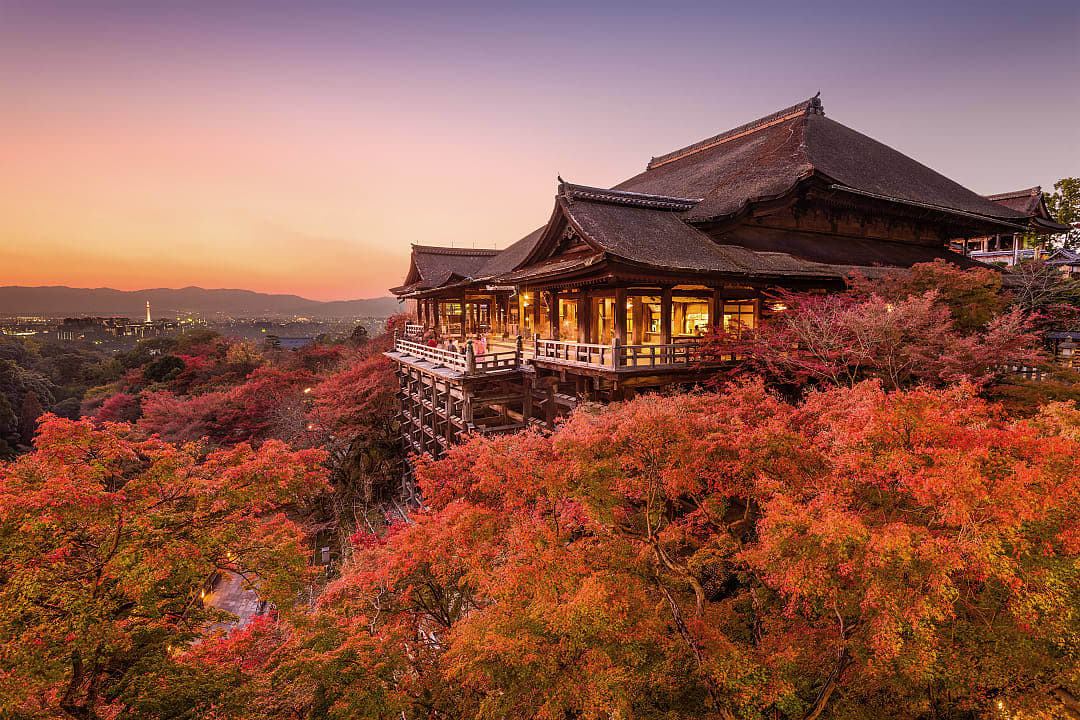 Kiyomizu-dera Temple at sunset with autumn leaves in Kyoto, Japan
