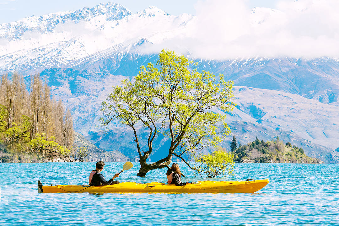 Couple kayaking on Lake Wanaka, New Zealand