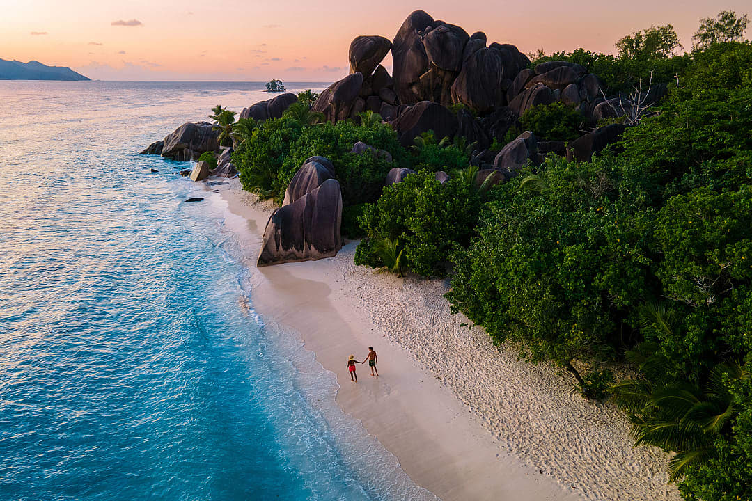 Couple on the beach in the Seychelless