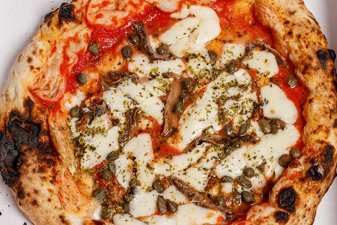 Sicilian pizza with anchovies and capers
