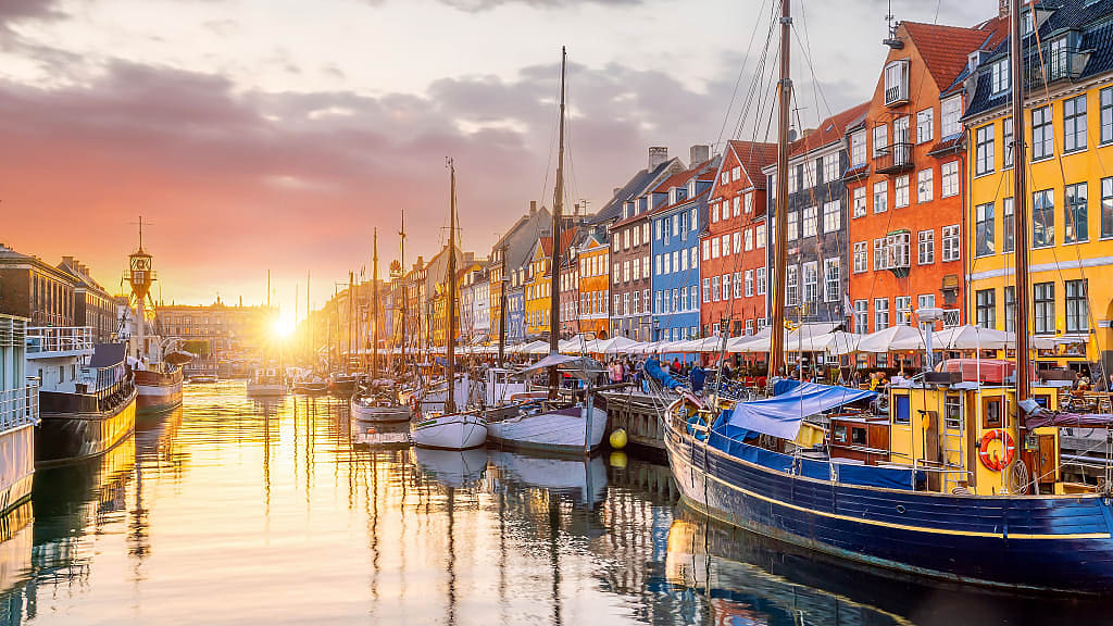 Old  Nyhavn Port in Copenhagen, Denmark at sunset