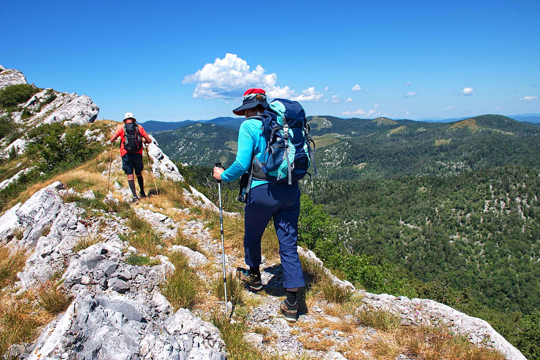 senior couple hiking Velebit mountain in Croatia