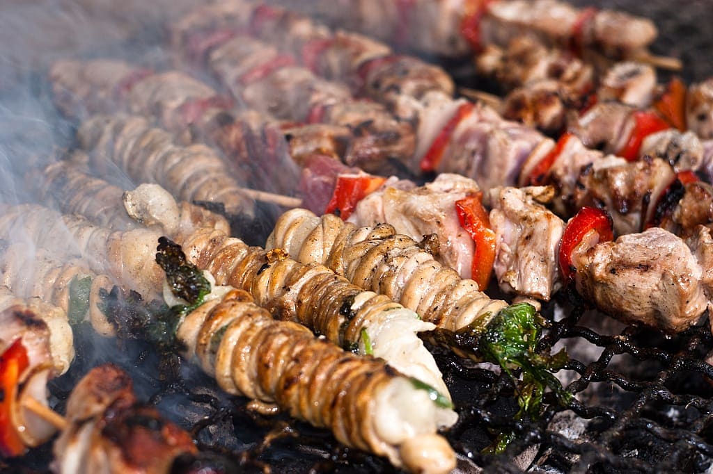 Stigghiole, a typical Sicilian street food of lamb goat or pork bowels with onions and parsley and grilled over coals