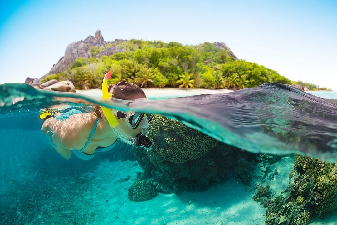 Woman snorkeling in the Seychelles.