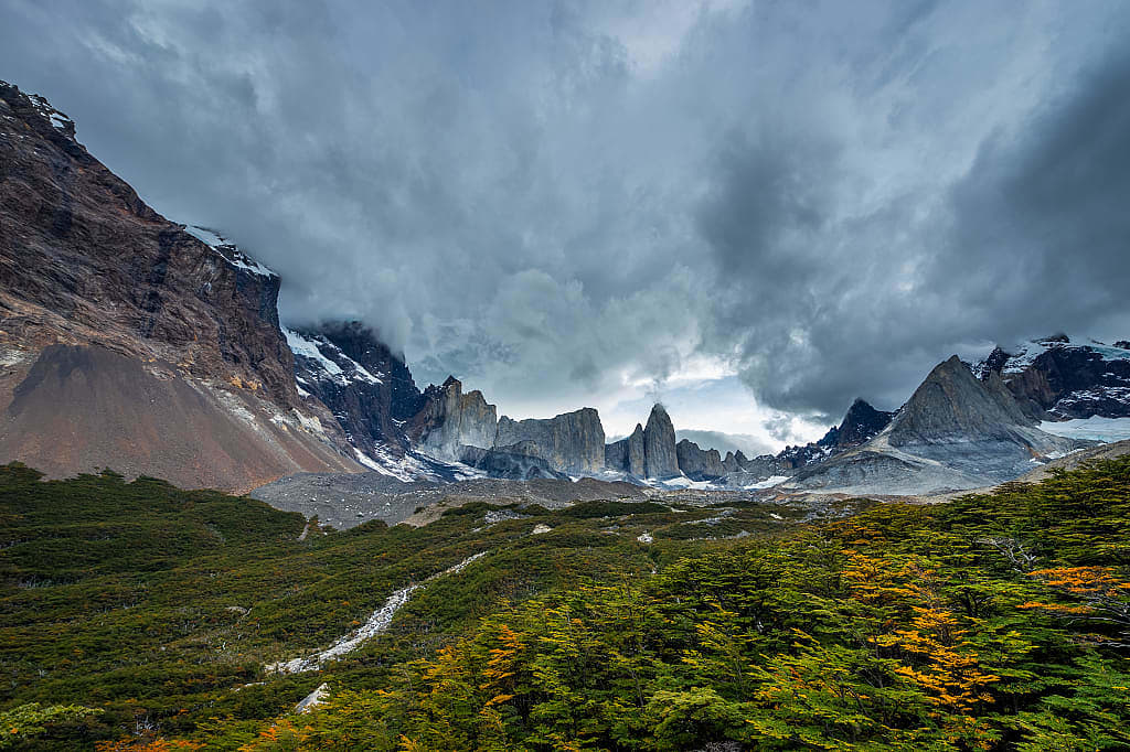 Surrounding mountains and colorful trees of the French Valley in Torres del Paine National Park, Patagonia, Chile