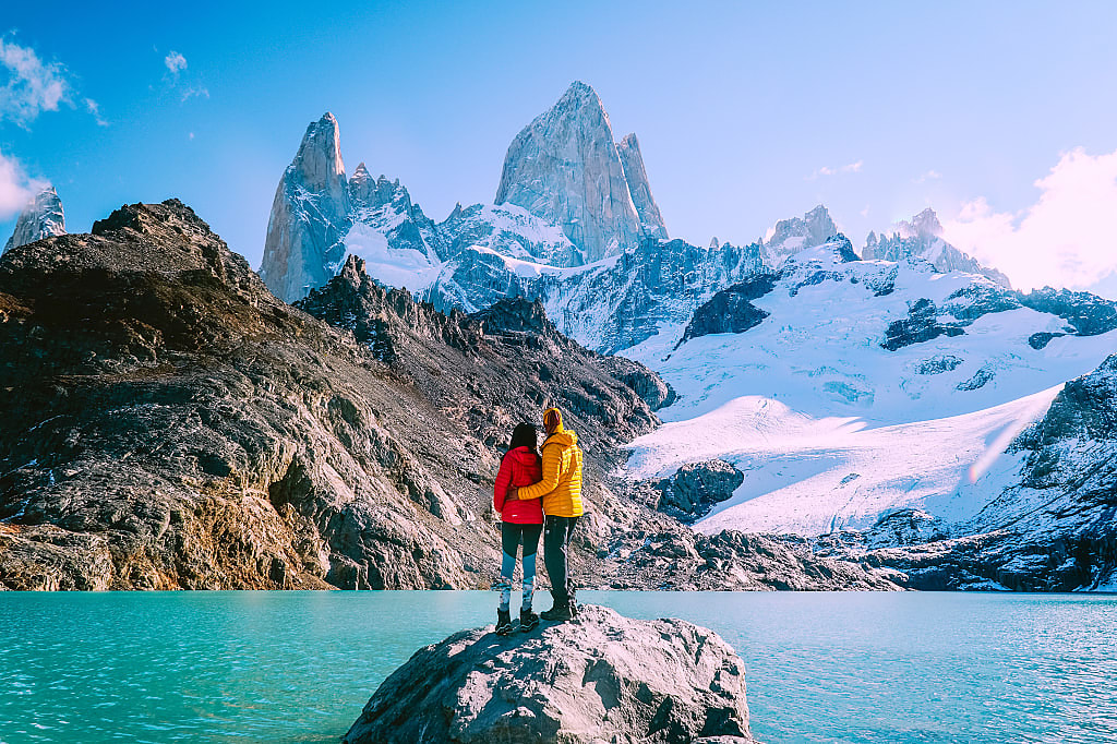Couple enjoying the view at Mount Fitzroy in Patagonia, Argentina