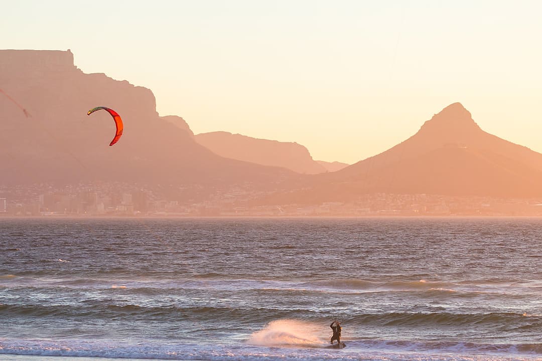 Kitesurfing at sunset in Cape Town, South Africa