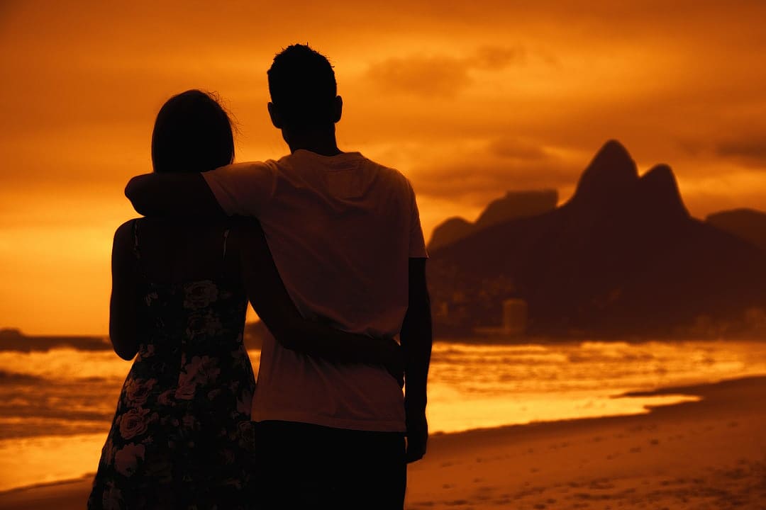Couple on beach in Rio de Janeiro, Brazil