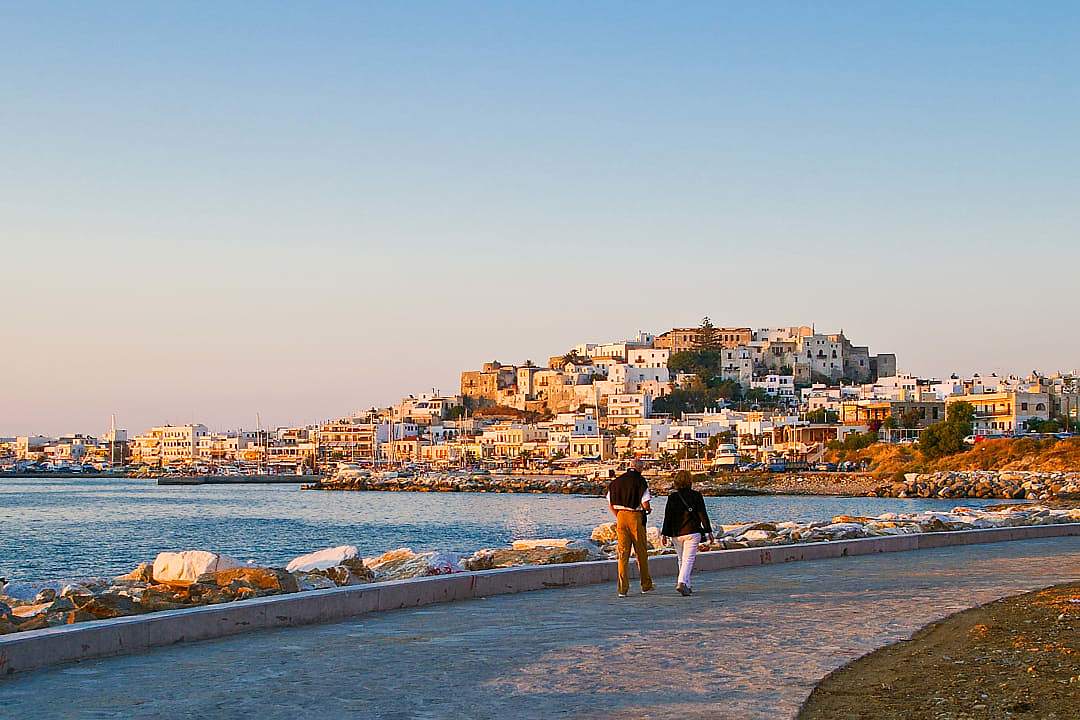 A couple takes a stroll in Naxos, Greece