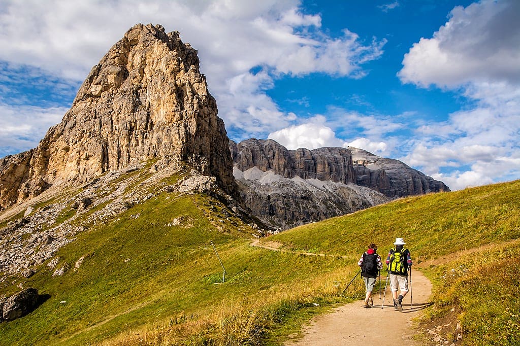 Active senior couple hiking in the Dolomites, South Tyrol, Italy