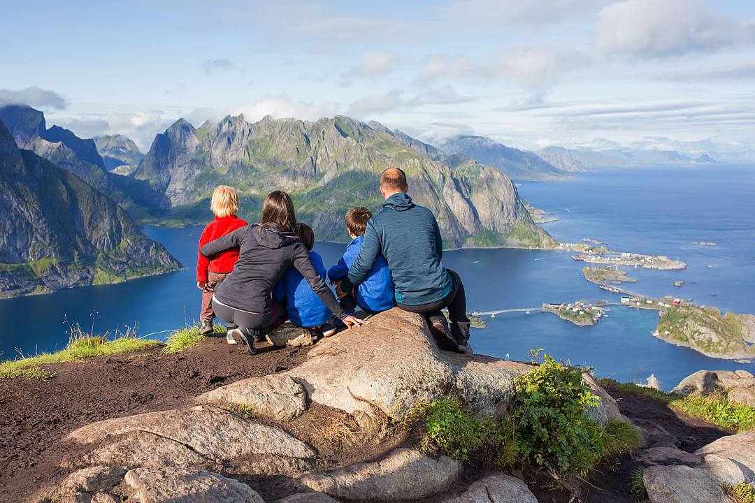 A family enjoys a view in Lofoten, Norway