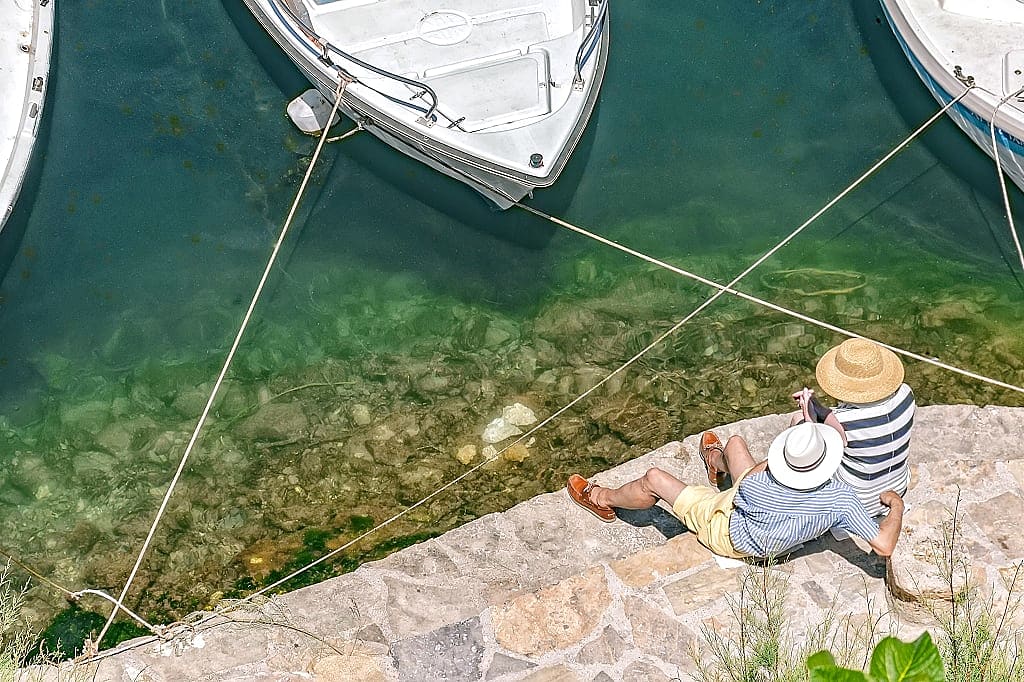 Couple by the lagoon Agios Nokolaos in Crete