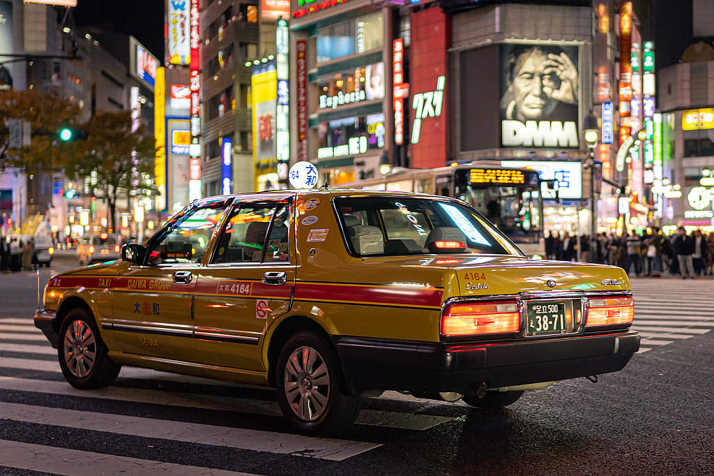 Taxi at Shibuya crossing in Tokyo, Japan