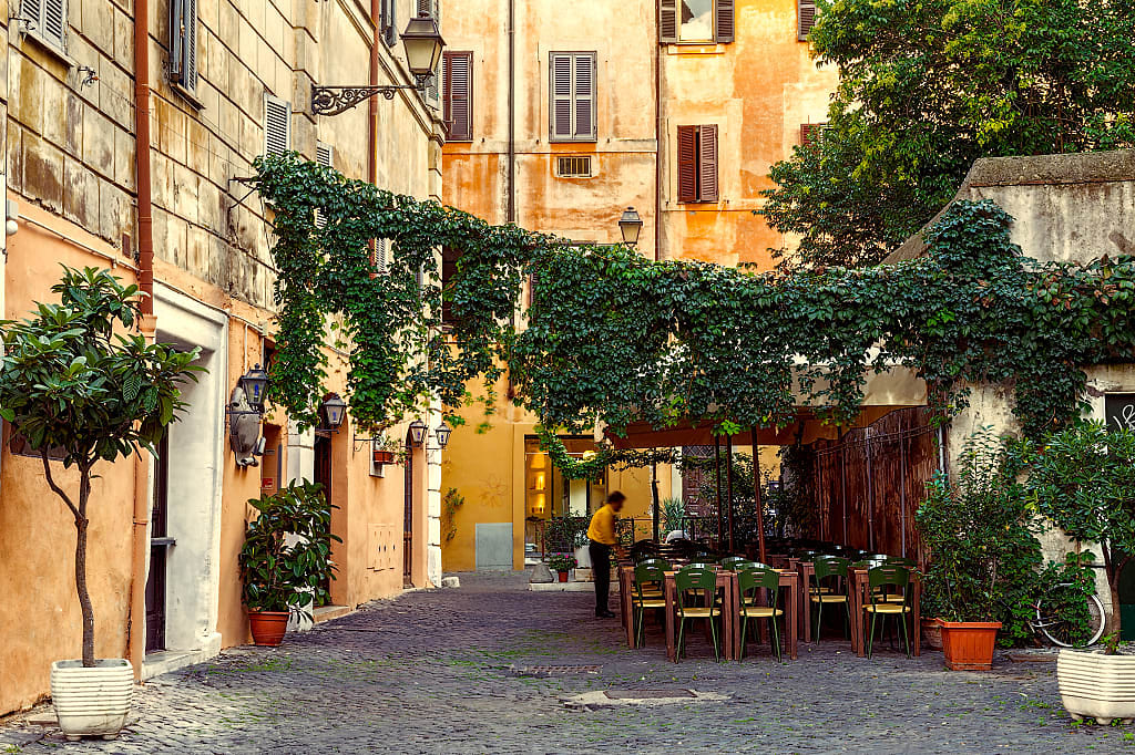 Outdoor restaurant seating in the Trastevere neighborhood of Rome, Italy