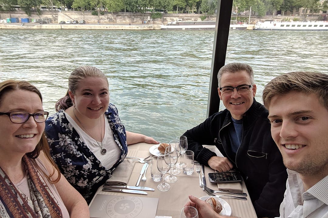 Dave and his family enjoying a boat ride on the River Seine in Paris, France