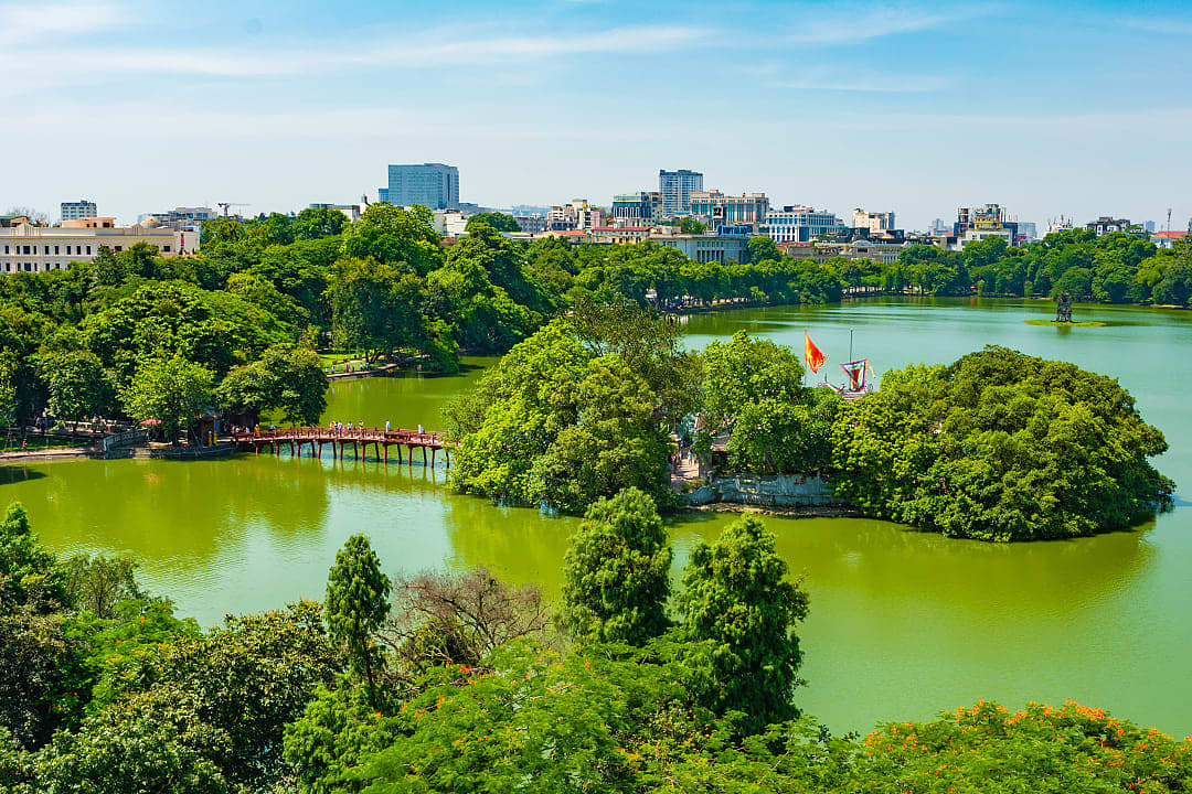 Hoan Kiem Lake surrounded by trees in Hanoi, Vietnam
