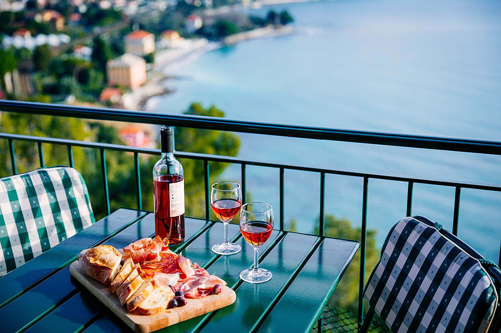Italian Salumi with wine and a coastal view