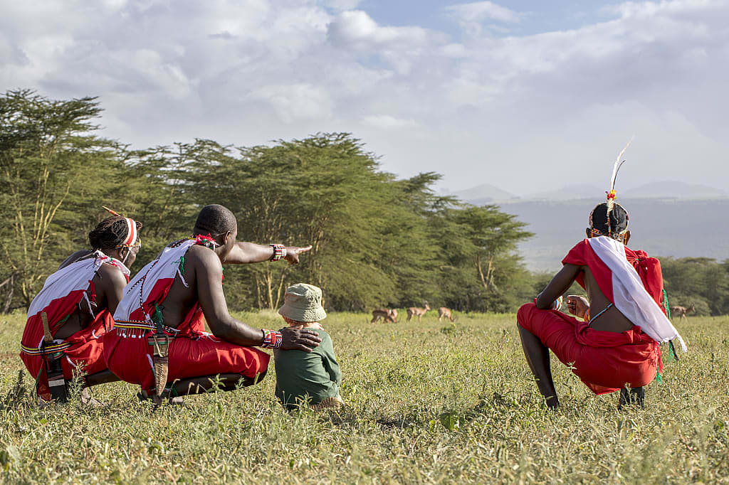 Kenyan guides on bush walk with kids in Kenya