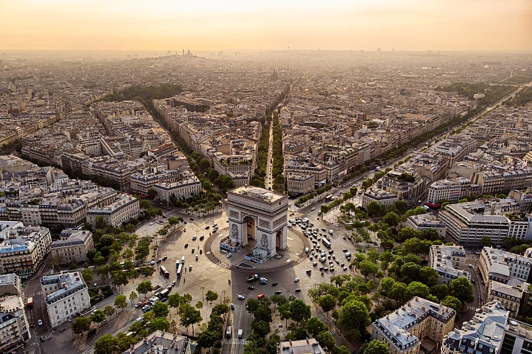 The Arc de Triomphe stands at Paris’ bustling central intersection.