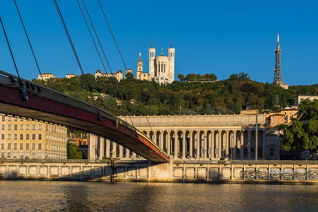 Bridge over the Saône river with Notre-Dame de Fourviere Basilica on the hill in Lyon, France
