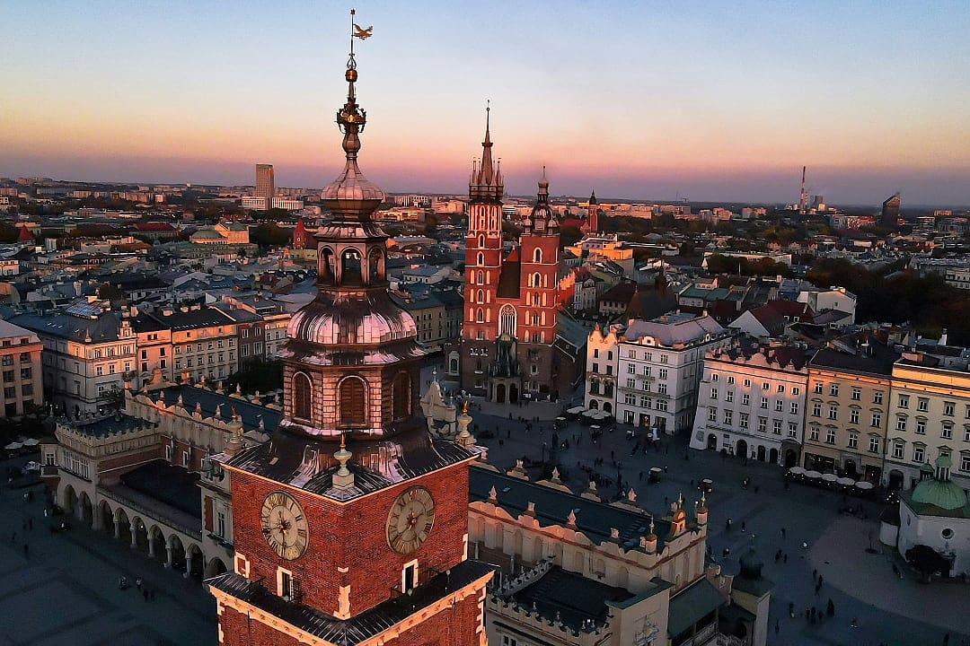 Aerial view of Kraków Main Market Square and St. Mary’s Basilica at sunset, Poland