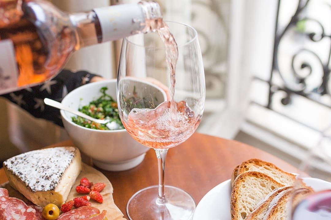 Rose wine poured into glass in Paris, France