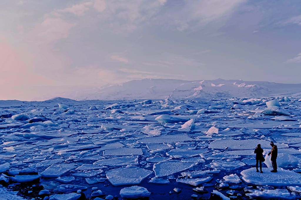 Couple at Jokulsarlon glacial lagoon in Iceland